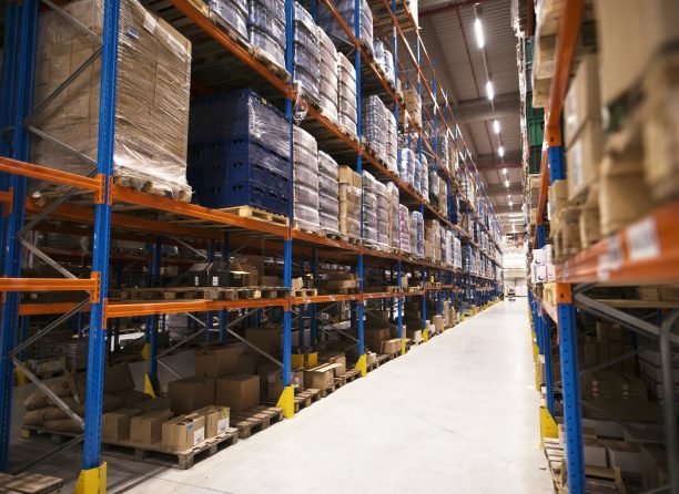 interior large distribution warehouse with shelves stacked with palettes goods ready market